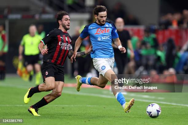Khvicha Kvaratskhelia of SSC Napoli and Davide Calabria of AC Milan battle for the ball during the Serie A match between AC MIlan and SSC Napoli at...