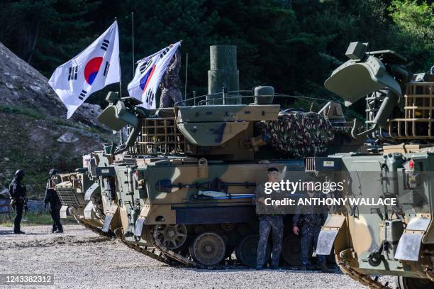 South Korean Army soldiers take part in a live fire military exercise during the Defense Expo Korea at a training field near the demilitarized zone...