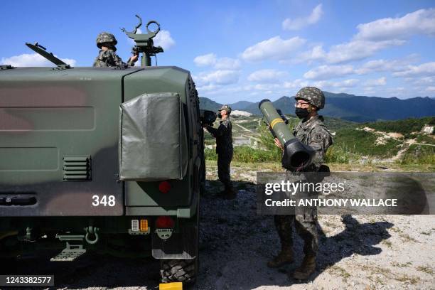 South Korean Army soldiers take part in a live fire military exercise during the Defense Expo Korea at a training field near the demilitarized zone...