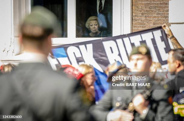 Princess Beatrix of the Netherlands watches the royal procession at the Royal Theater, known as Koninklijke Schouwburg, during the Prince's Day in...