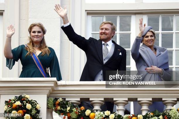 Netherlands' Crown Princess Catharina-Amalia, King Willem-Alexander and Queen Maxima wave from the balcony of the Noordeinde Palace during the...