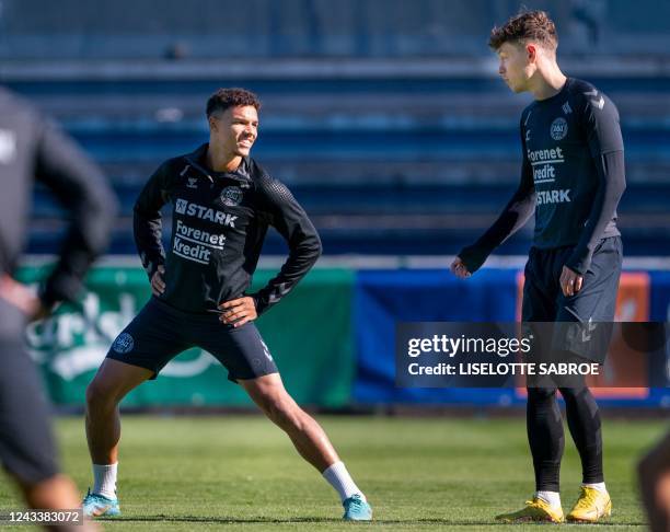 Denmark's forward Andreas Skov Olsen and Denmark's defender Alexander Bah attend a training session in Helsingor, Denmark, on September 20 two days...