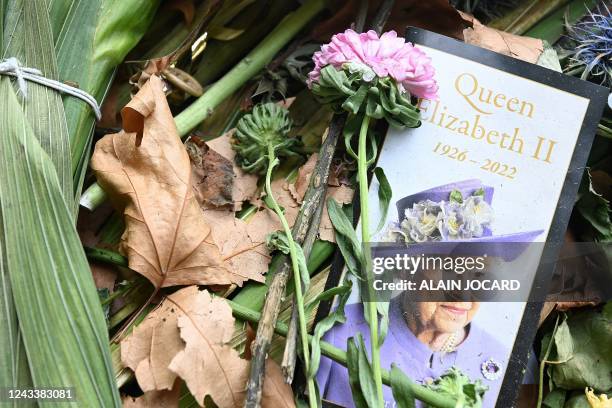 Flowers and tributes left in Green Park are pictured in London on September 20 a day after the funeral of Queen Elizabeth II. - Britain said farewell...