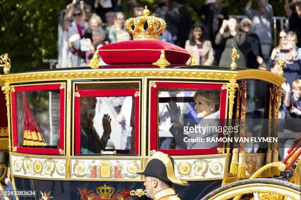 Queen Maxima waves from the Glass Carriage moving from the Lange Voorhout and the Noordeinde Palace in The Hague, on September 20, 2022. - The new...