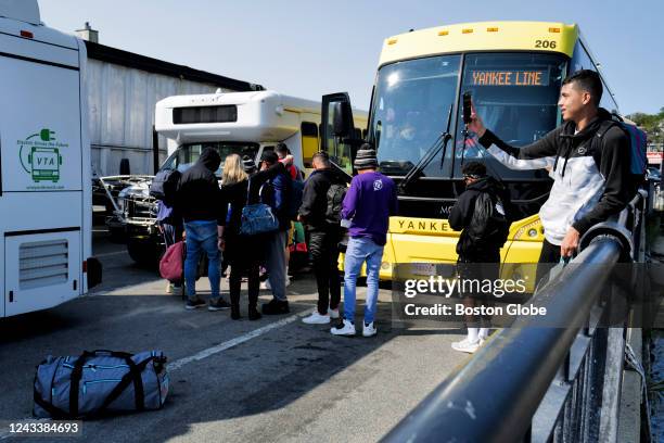 Martha's Vineyard, MA Venezuelan migrants gather at the Vineyard Haven ferry terminal in Marthas Vineyard. The group was transported to Joint Base...