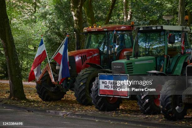 Tractors belonging to Dutch farmers are parked with protest boards and Dutch flags upside down on a road on the outskirt of The Hague on September...