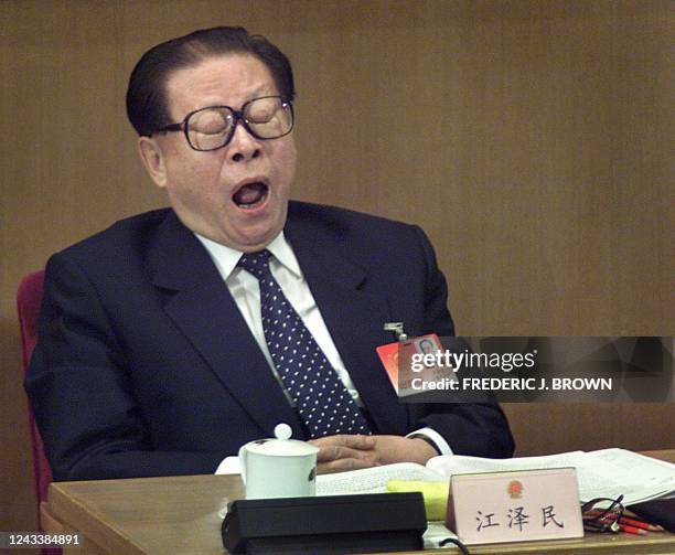 Chinese President Jiang Zemin yawns during speeches at a session of the National People's Congress at the Great Hall of the People in Beijing, 11...