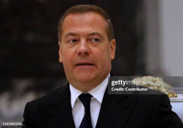 Russian Security Council Deputy Chairman and former President Dmitry Medvedev grimases during a meeting on the military-industrial complex at the...