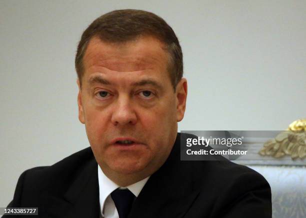 Russian Security Council Deputy Chairman and former President Dmitry Medvedev smiles during a meeting on the military-industrial complex at the...