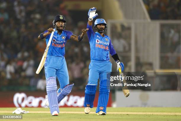 Hardik Pandya of India and Dinesh Karthik of India during game one of the T20 International series between India and Australia at Punjab Cricket...