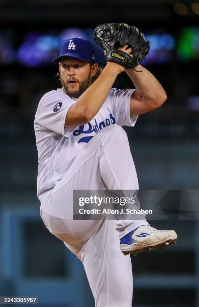 Los Angeles, CA Dodgers starting pitcher Clayton Kershaw winds up as he delivers a pitch against the Diamondbacks at Dodger Stadium in Los Angeles...