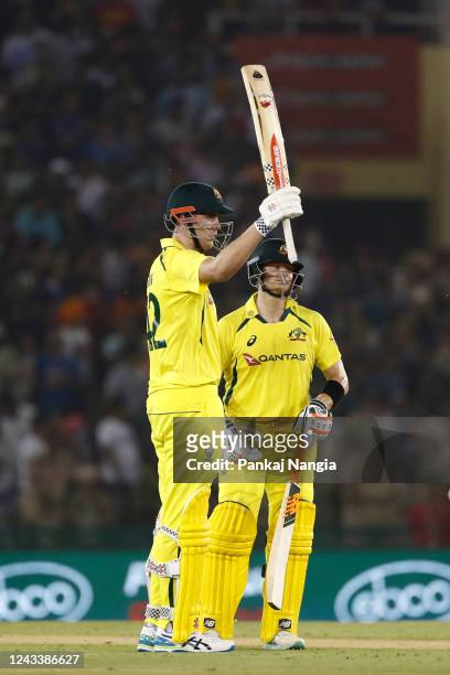 Cameron Green of Australia celebrates after scoring fifty during game one of the T20 International series between India and Australia at Punjab...