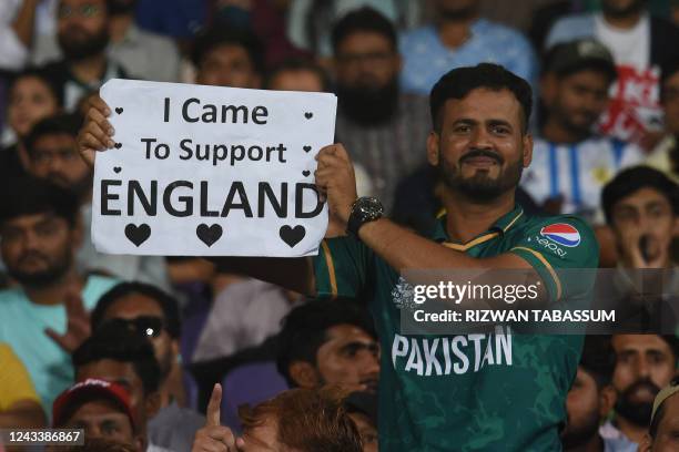 Cricket fan holds a placard during the first Twenty20 international cricket match between Pakistan and England at the National Cricket Stadium in...