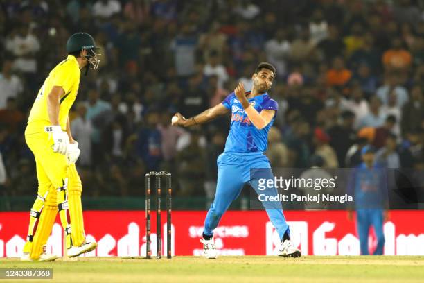 Bhuvneshwar Kumar of India bowls during game one of the T20 International series between India and Australia at Punjab Cricket Association Stadium on...