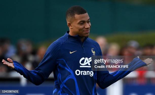 French forward Kylian Mbappe gestures during a training session in Clairefontaine-en-Yvelines on September 20, 2022 as part of the team's preparation...