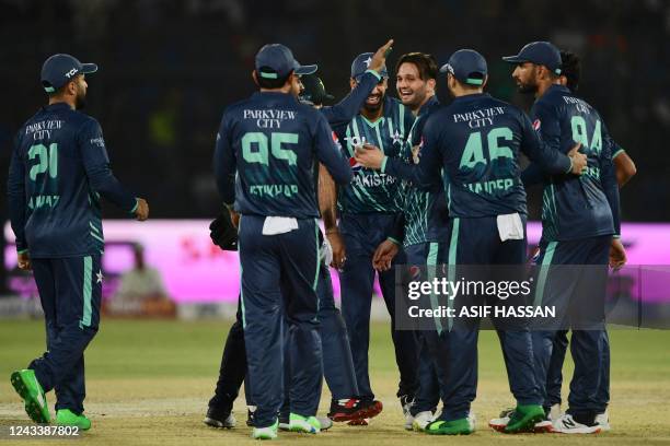 Pakistan's cricketers celebrate after the dismissal of England's Ben Duckett during the first Twenty20 international cricket match between Pakistan...