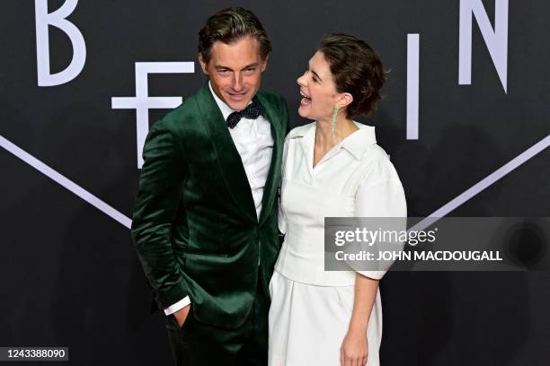 German actor Volker Bruch and German actress Liv Lisa Fries pose on the red carpet upon arrival for the premiere of the 'Babylon Berlin' tv series'...