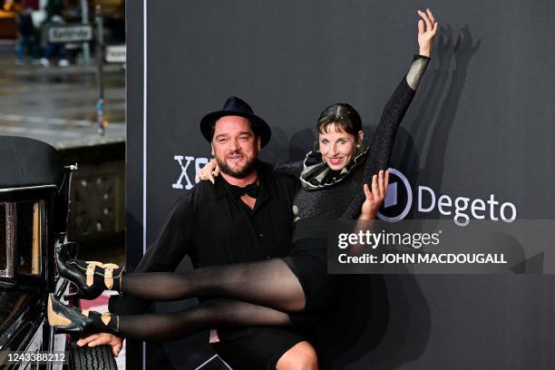 German actors Ronald Zehrfeld and Meret Becker pose on the red carpet upon arrival for the premiere of the 'Babylon Berlin' tv series' fourth season,...