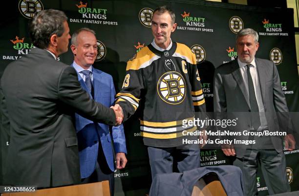 September 20: Former Boston Bruins captain, Zdeno Chara holds his jersey along with Don Sweeney, Charlie Jacobs and Cam Neely after announcing his...