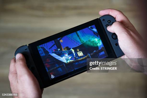 Photograph shows a screen of a Nintendo Switch console displaying the adventure video game «Return to Monkey Island » in Paris on September 20, 2022....