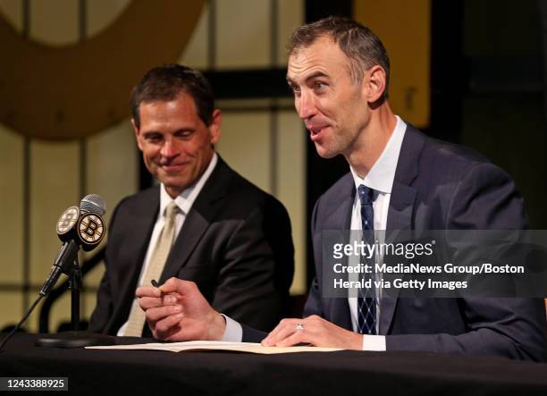 September 20: General Manager of the Boston Bruins, Don Sweeney watches as former Boston Bruins captain, Zdeno Chara signs a one day contract with...