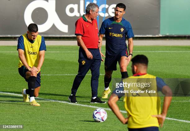 Fernando Santos of Portugal talks with Cristiano Ronaldo of Manchester United and Portugal during the Portugal National Team Training Session at...