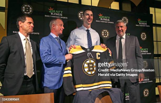 September 20: Former Boston Bruins captain, Zdeno Chara holds his jersey along with Don Sweeney, Charlie Jacobs and Cam Neely after announcing his...