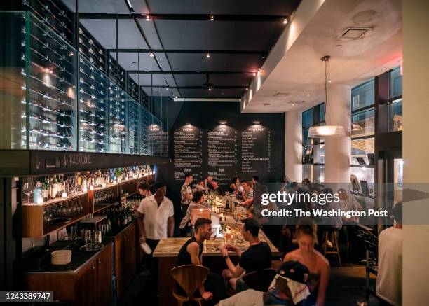 Steady crowd keeps Ardesia, a wine bar near the theater district in Midtown Manhattan, busy late into the night on Friday evening, July 29, 2022 in...