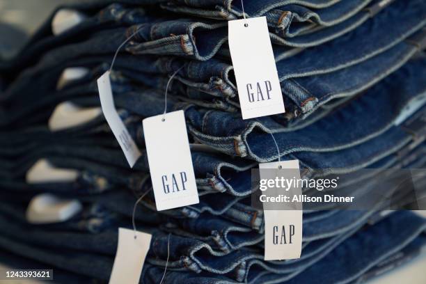 Gap price tags are seen on jeans at the Gap retail store on September 20, 2022 in Los Angeles, California. Gap Inc. Is set to cut about 500 corporate...