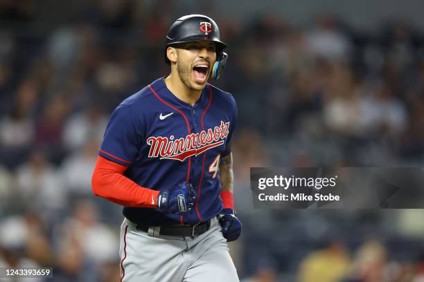 Carlos Correa of the Minnesota Twins reacts after hitting a 2-run home run to left field in the eighth inning against the New York Yankees at Yankee...