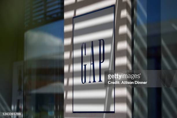 Gap retail store sign in Century City on September 20, 2022 in Los Angeles, California. Gap Inc. Is set to cut about 500 corporate jobs as the...