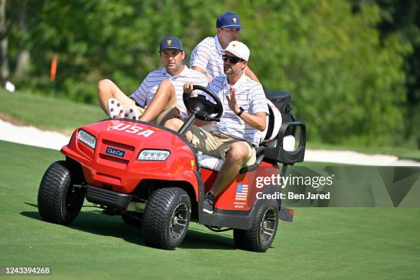 Sam Burns drives Scottie Scheffler and Webb Simpson down the 12th hole prior to Presidents Cup at Quail Hollow September 19 in Charlotte, North...