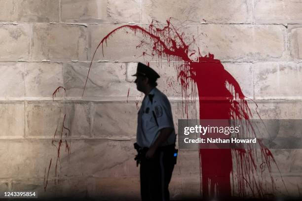 The U.S. Park Police guard the Washington Monument after a vandal wrote graffiti and threw red paint against the base of the structure on September...