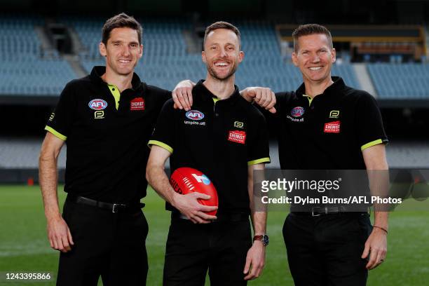Field umpires Matt Stevic , Brendan Hosking and Simon Meredith pose for a photo during the 2022 Grand Final Umpires Announcement at Marvel Stadium on...