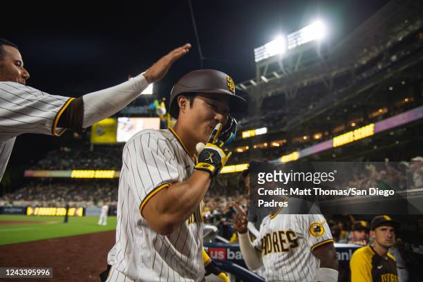 Ha-seong Kim of the San Diego Padres celebrates after hitting a home run in the fourth inning against the St. Louis Cardinals at PETCO Park on...