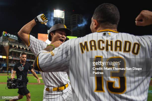Ha-seong Kim and Manny Machado of the San Diego Padres celebrate after Kim's a home run in the fourth inning against the St. Louis Cardinals at PETCO...