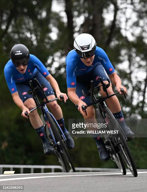 Italy's Elisa Longo Borghini and Vittoria Guazzini compete in the team time trial mixed relay cycling event at the UCI 2022 Road World Championship...