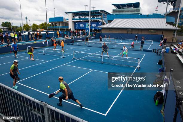 Amateur pickleball players play mixed double matches during the Professional Pickleball Association Baird Wealth Management Open at the Lindner...