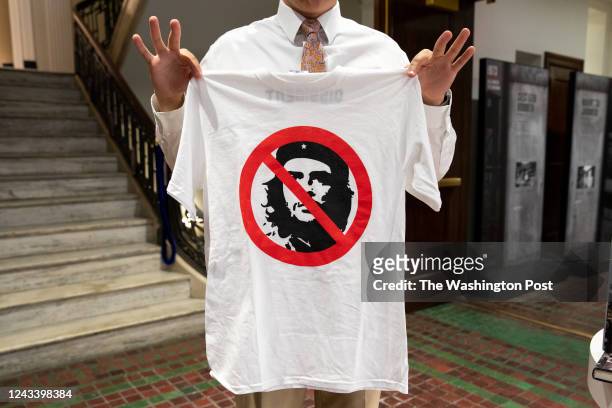 Joseph Spalding holds up an anti-Che Guevara t-shirt at the Victims of Communism Museum in Washington, D.C., on August 25, 2022.