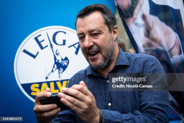 Matteo Salvini, leader of Italian right party Lega , holds a mobile phone during a rally as part of the campaign for general elections. Italians head...