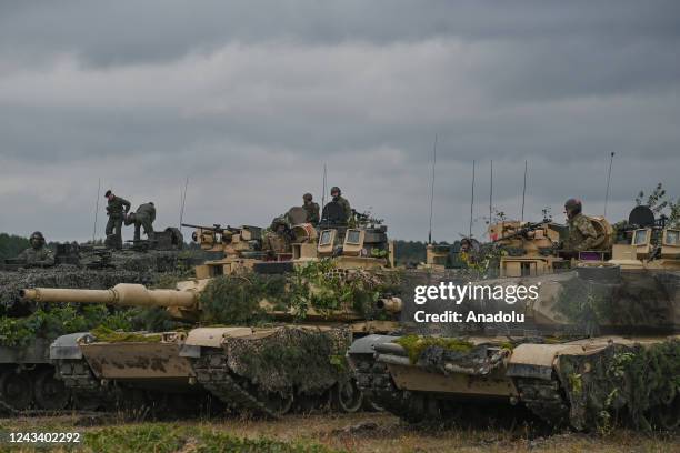 The M1 Abrams, a third-generation American main battle tanks, are seen at the end of the joint military exercises, at the training ground in Nowa...