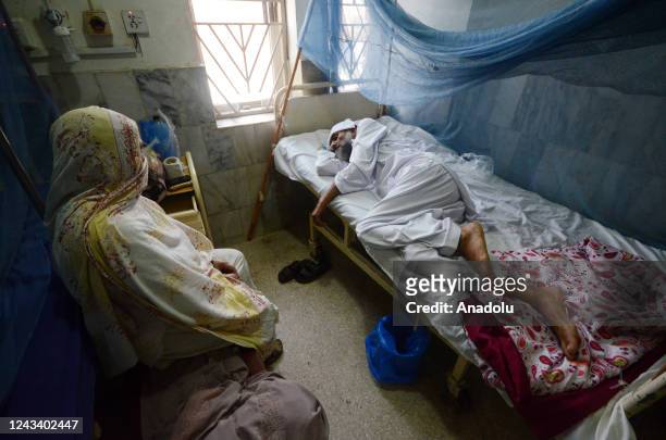 Patients suffering from dengue fever receive medical treatment at an isolation ward of a Lady Reading government hospital in Peshawar, Pakistan, 19...