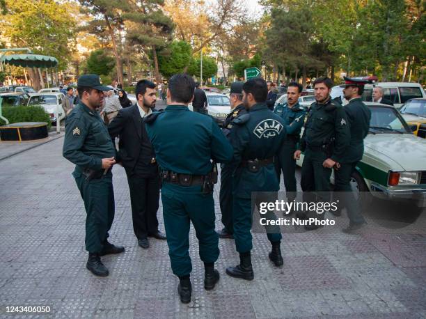 April 23, 2007 file photo shows, Iranian morality policemen stand on a street-side in Tehran. Thousands of Iranians protest the death of Mahsa Amini,...