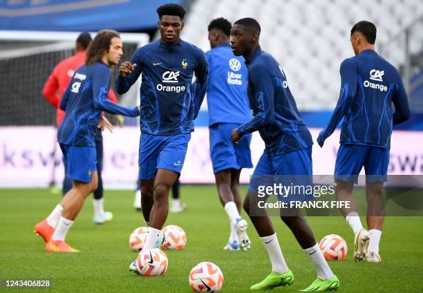 Fance's midfielder Aurelien Tchouameni attends a training session at the Stade de France stadium in Saint-Denis, north of Paris, on September 21,...