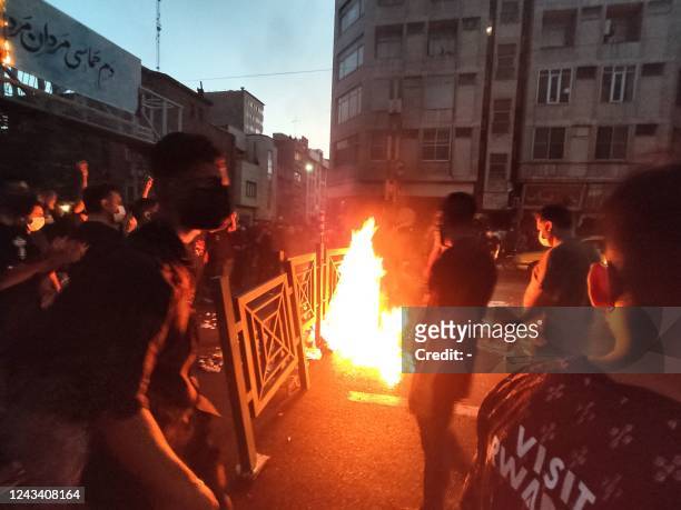 Picture obtained by AFP outside Iran on September 21 shows Iranian demonstrators taking to the streets of the capital Tehran during a protest for...