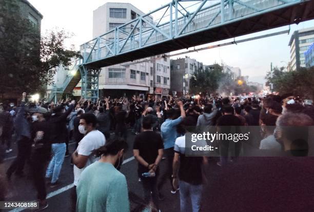 Picture obtained by AFP outside Iran on September 21 shows Iranian demonstrators taking to the streets of the capital Tehran during a protest for...