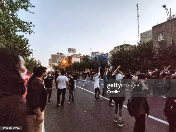 Picture obtained by AFP outside Iran on September 21 shows Iranian demonstrators taking to the streets of the capital Tehran during a protest for...