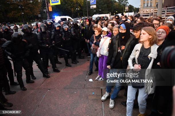 Police officers detain demonstrators in Saint Petersburg on September 21 following calls to protest against partial mobilisation announced by...