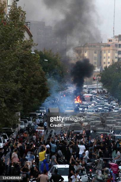 Picture obtained by AFP outside Iran on September 21 shows Iranian demonstrators taking to the streets of the capital Tehran during a protest for...