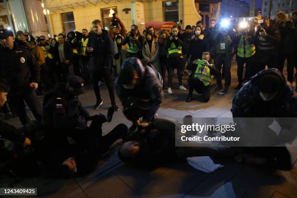 Russian Police officers detain protesters during an unsanctioned anti-war protest rally at Arbat street, on September 21 in Moscow, Russia. More than...